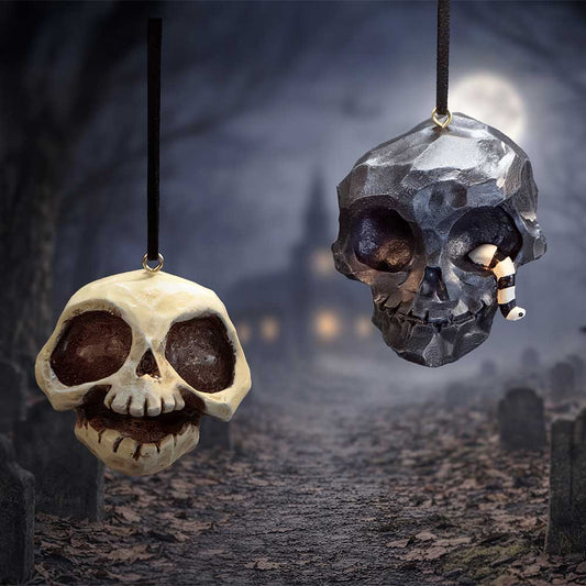 Grim and Grin set of two black and white skull hanging ornaments, including black skull with worm detail, by Nemesis Now