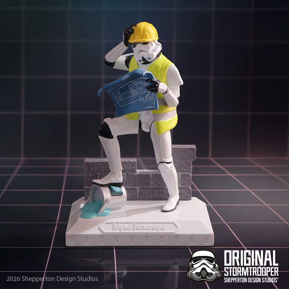 Original Stormtrooper Hit a Brick Wall Figurine - construction figurine on a dark grid surface
