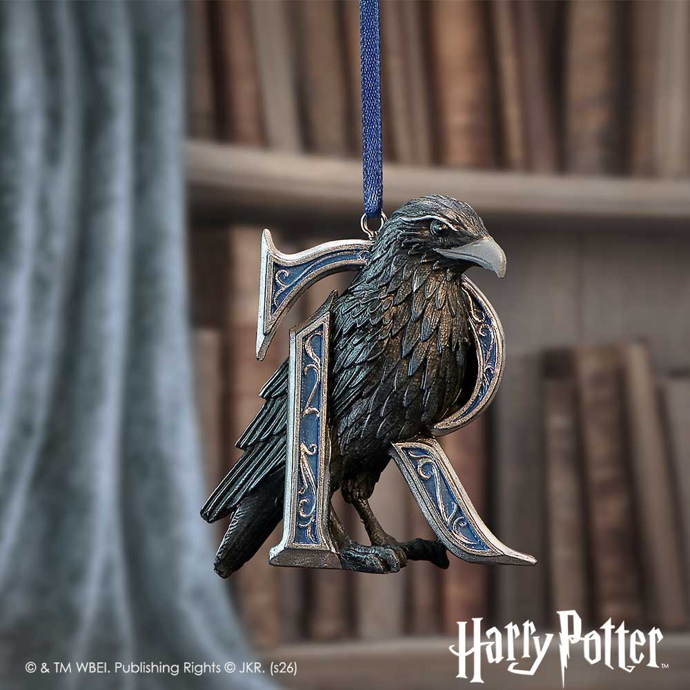 Harry Potter Ravenclaw Hanging Ornament - Blue-ribbon bird ornament displayed before bookshelves