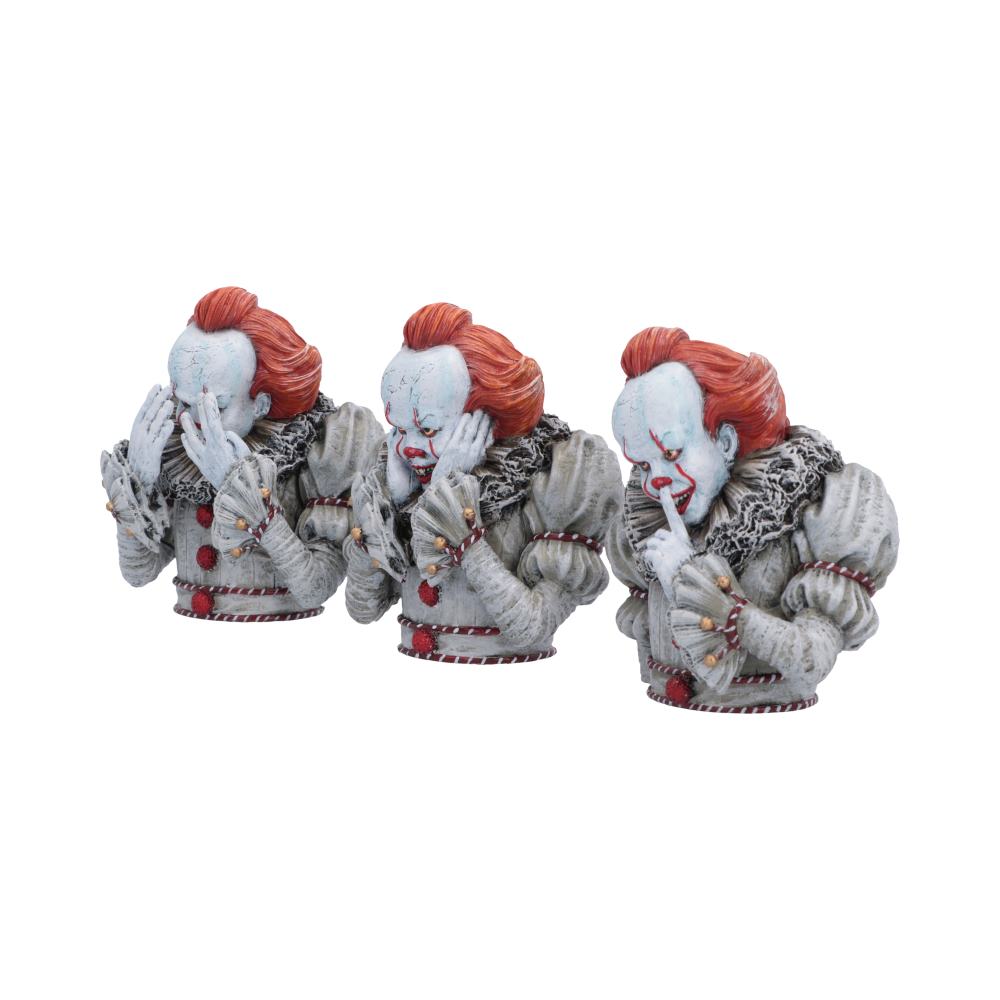 IT Three Wise Pennywise Figurines - Angled view of pale faces and red-haired clown heads