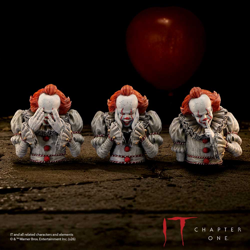 IT Three Wise Pennywise Figurines - Three Pennywise busts on a dark tabletop