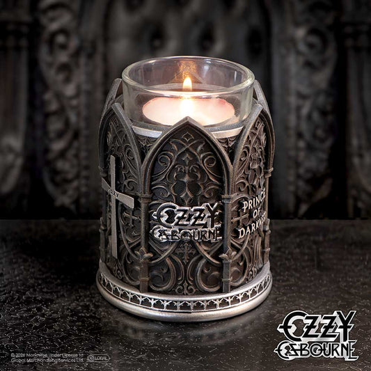 Ozzy Osbourne Prince of Darkness Tea Light Holder - Ozzy holder with lit tea light on a dark tabletop