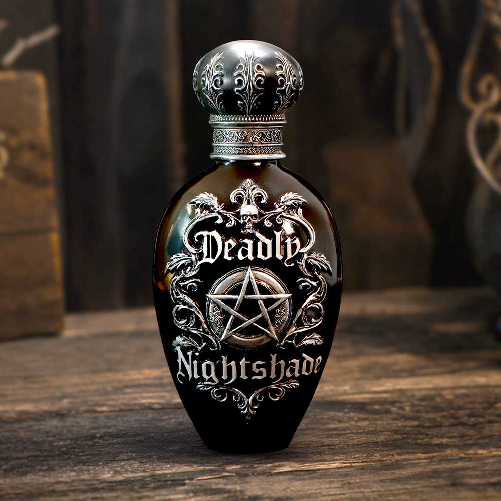 Deadly Nightshade Bottle Figurine - Nightshade figurine on a warm textured display surface