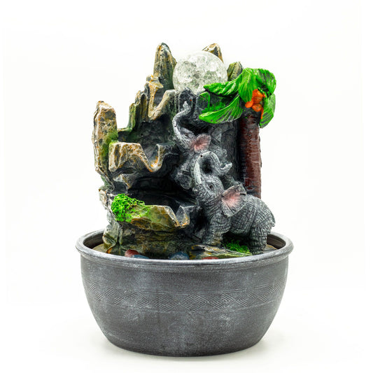 Elephants and palm tree tabletop water feature with flowing water