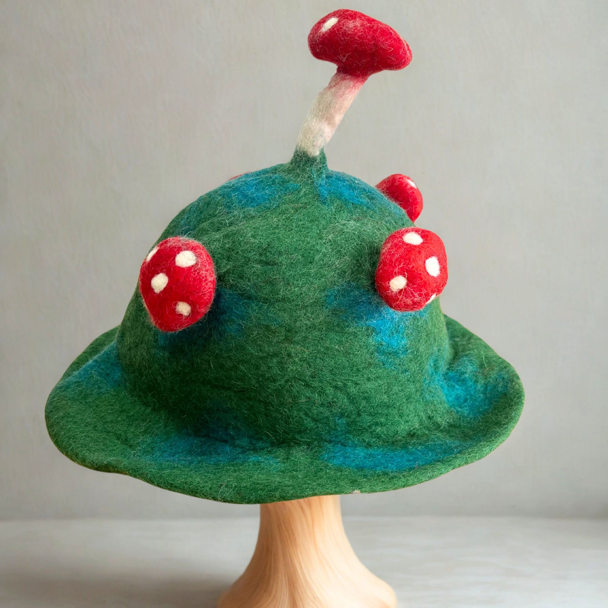Felted Mushroom Hat in moss mountain green felted wool with rounded silhouette
