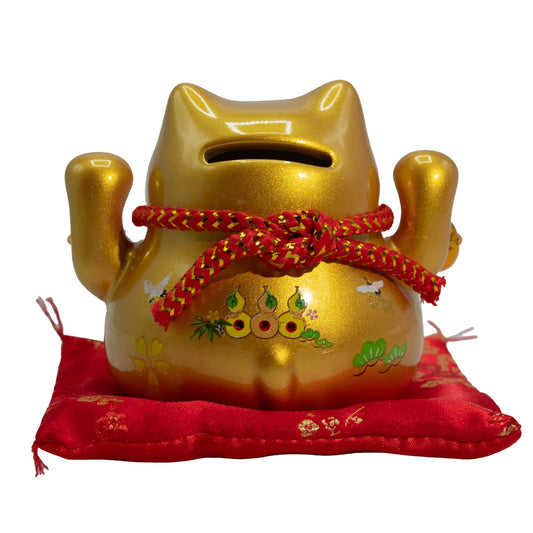 Ceramic money cat bank gold on cushion Maneki Neko for wealth and savings