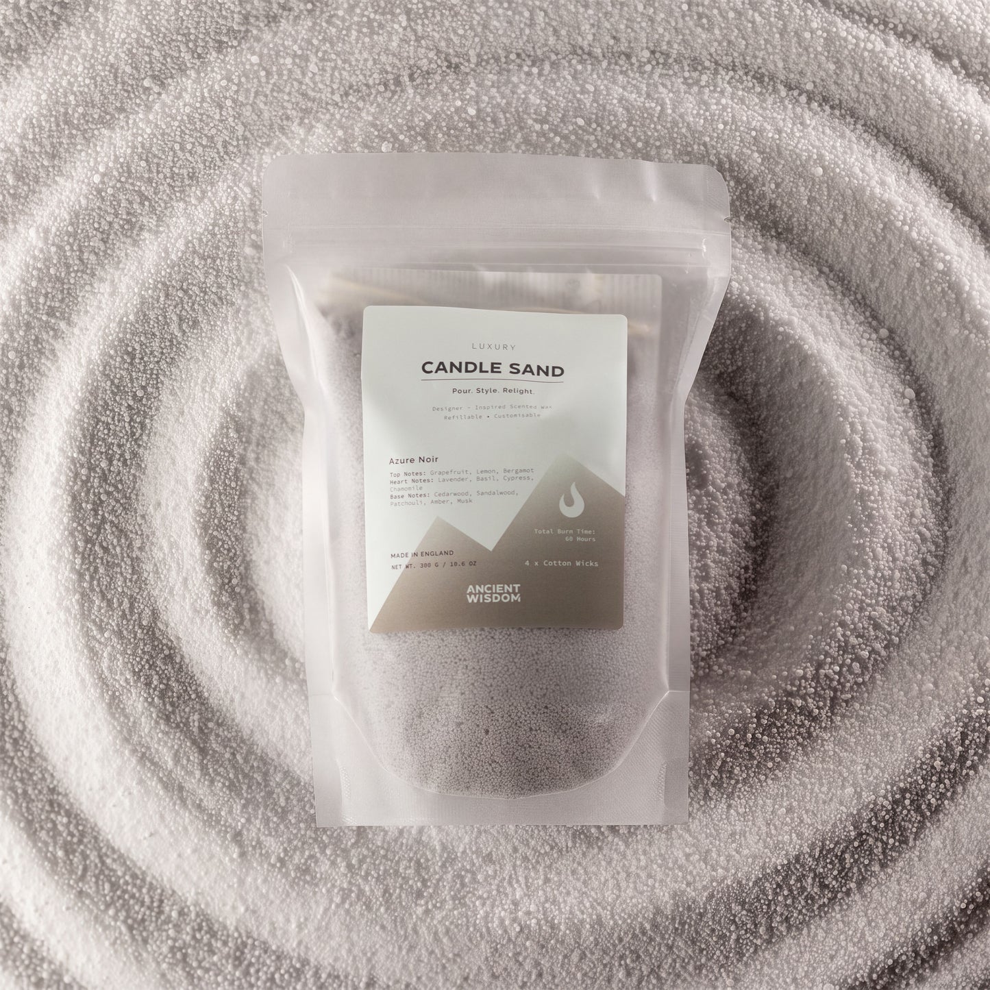 Warm grey Azure Noir fragranced candle sand with four cotton wicks