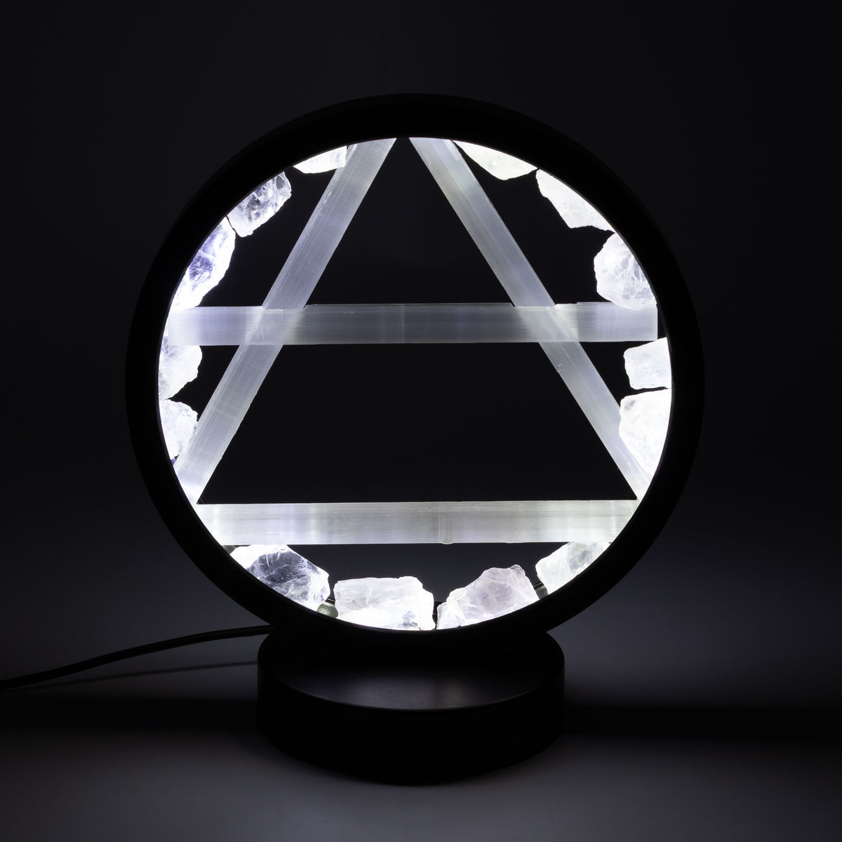 Air Gemstone Halo Lamp with clear quartz halo and selenite Air symbol illuminated on metal stand UK