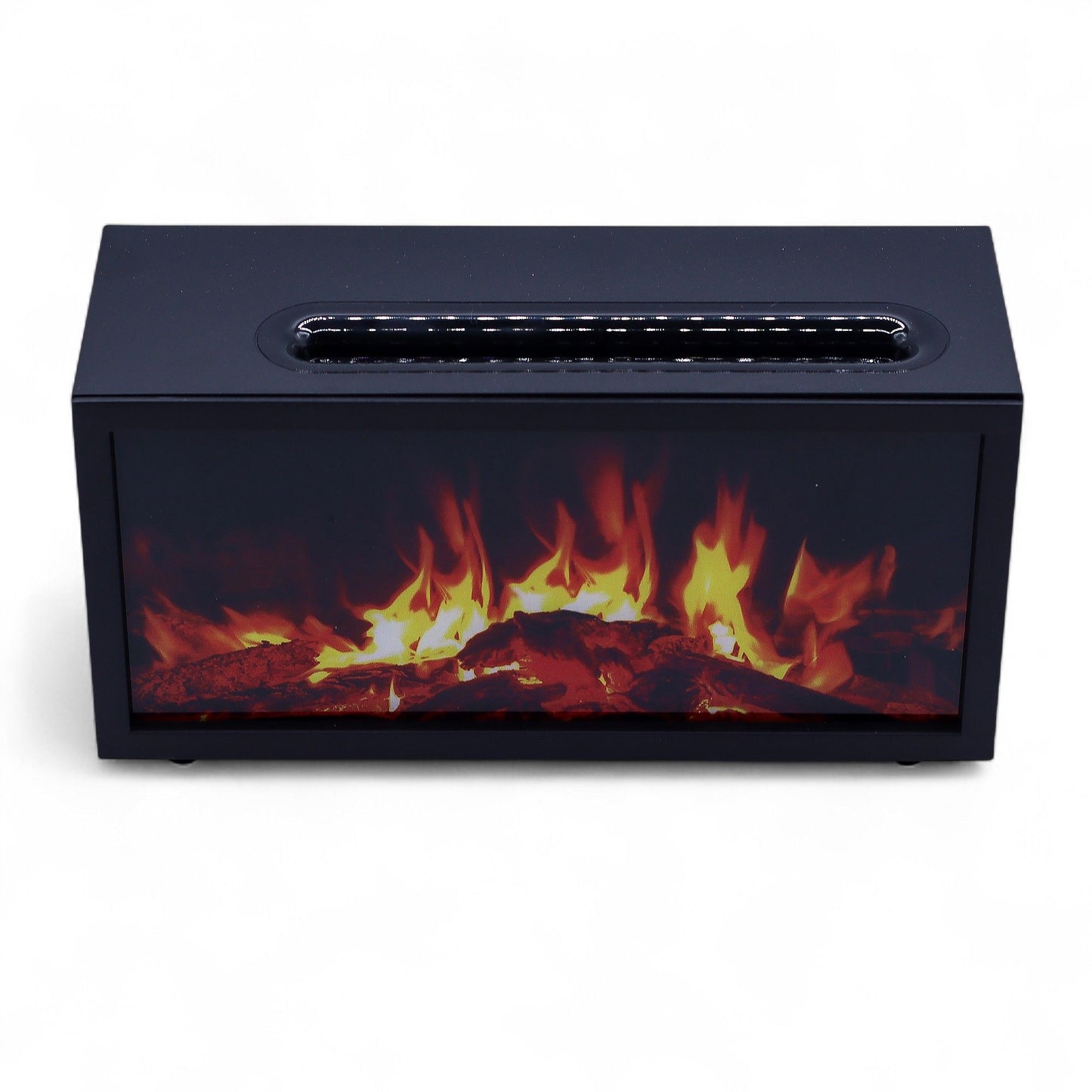 Rectangular black tabletop electric fireplace displays glowing orange and yellow flames behind a glass front, sitting on a white surface in a minimal studio setting.