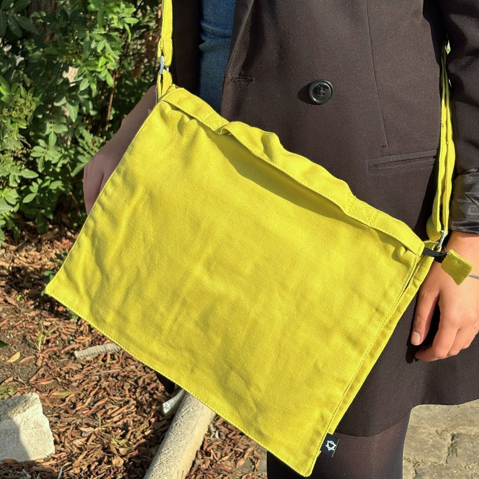 Cotton Canvas Laptop Messenger Bag in mustard with adjustable shoulder strap for laptops and everyday essentials.