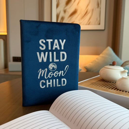 Stay Wild Moon Child Velvet Journal dark blue cover with celestial text – soft velvet journal for writing and reflection