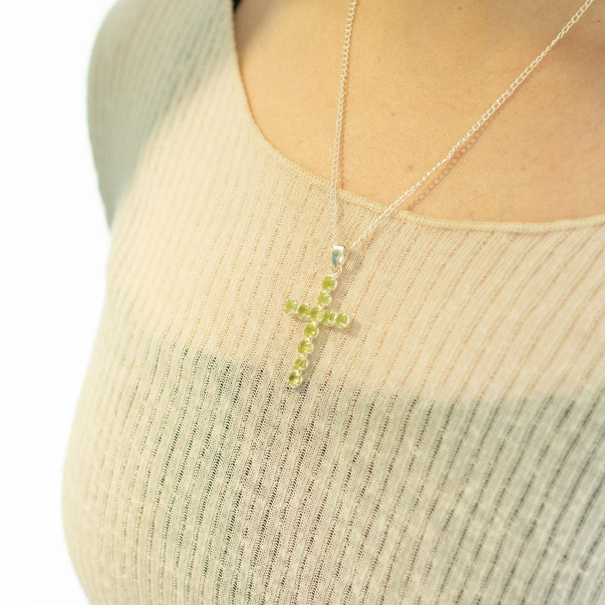 Silver plated Peridot crucifix pendant with faceted lime-green gemstones and 45cm chain for Christian devotional jewellery UK