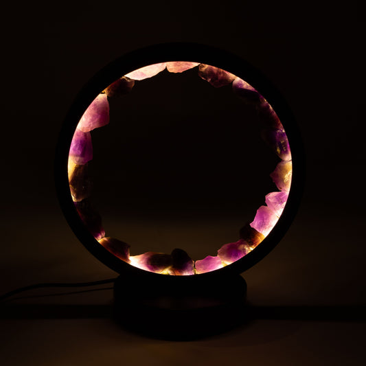 Zen Spirit Amethyst Gemstone Halo Lamp with glowing purple crystal ring on black metal stand UK