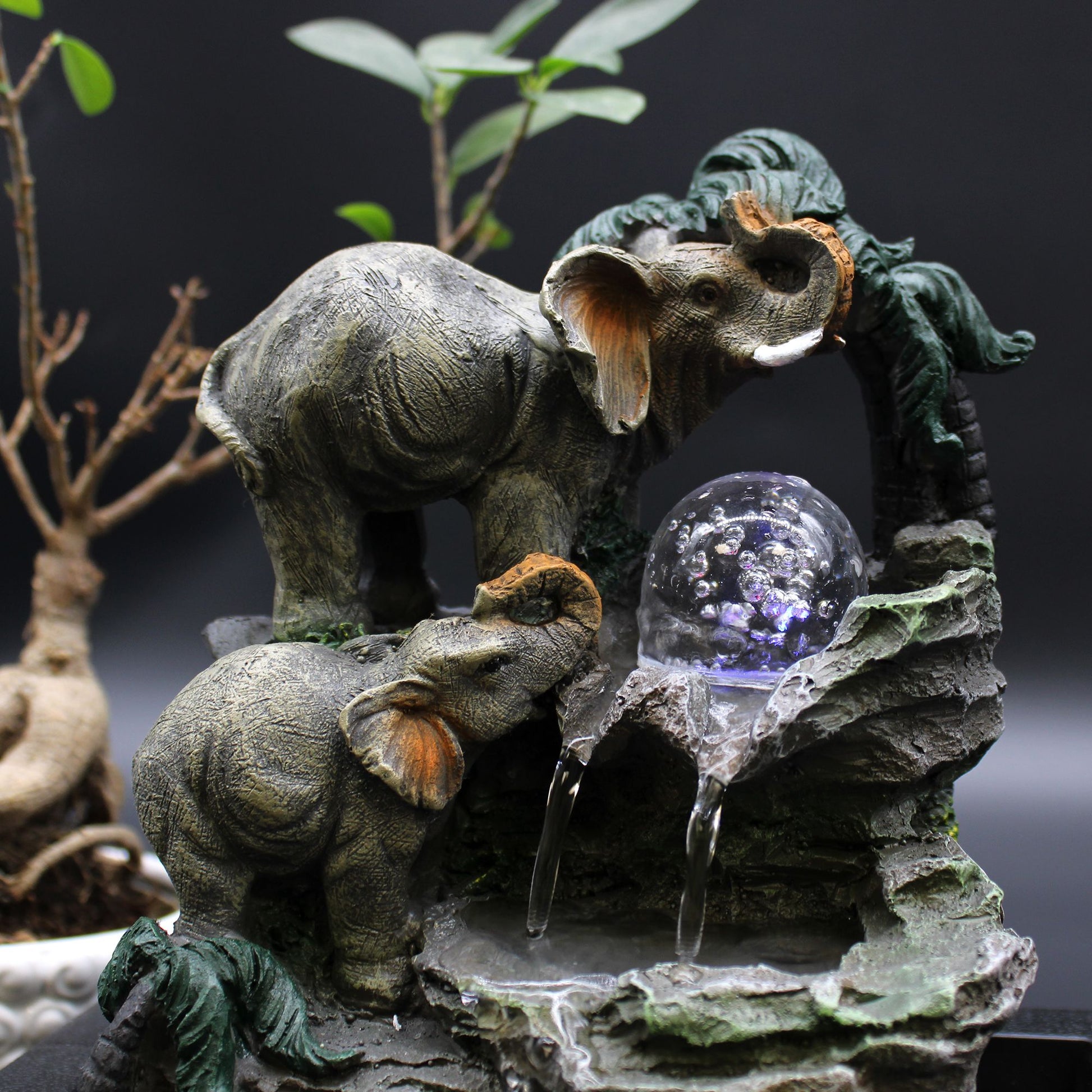 Elephant family tabletop water feature with flowing water
