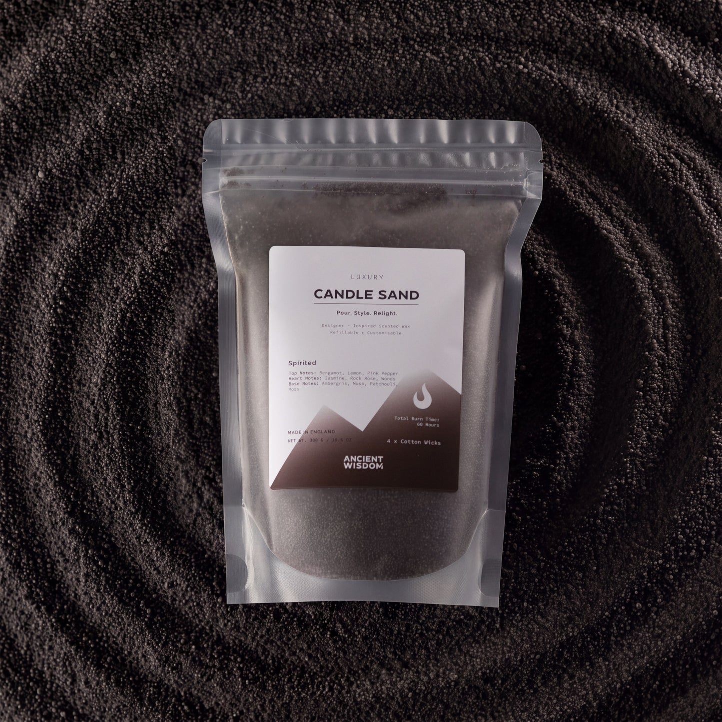 Black Spirited fragranced candle sand with four cotton wicks
