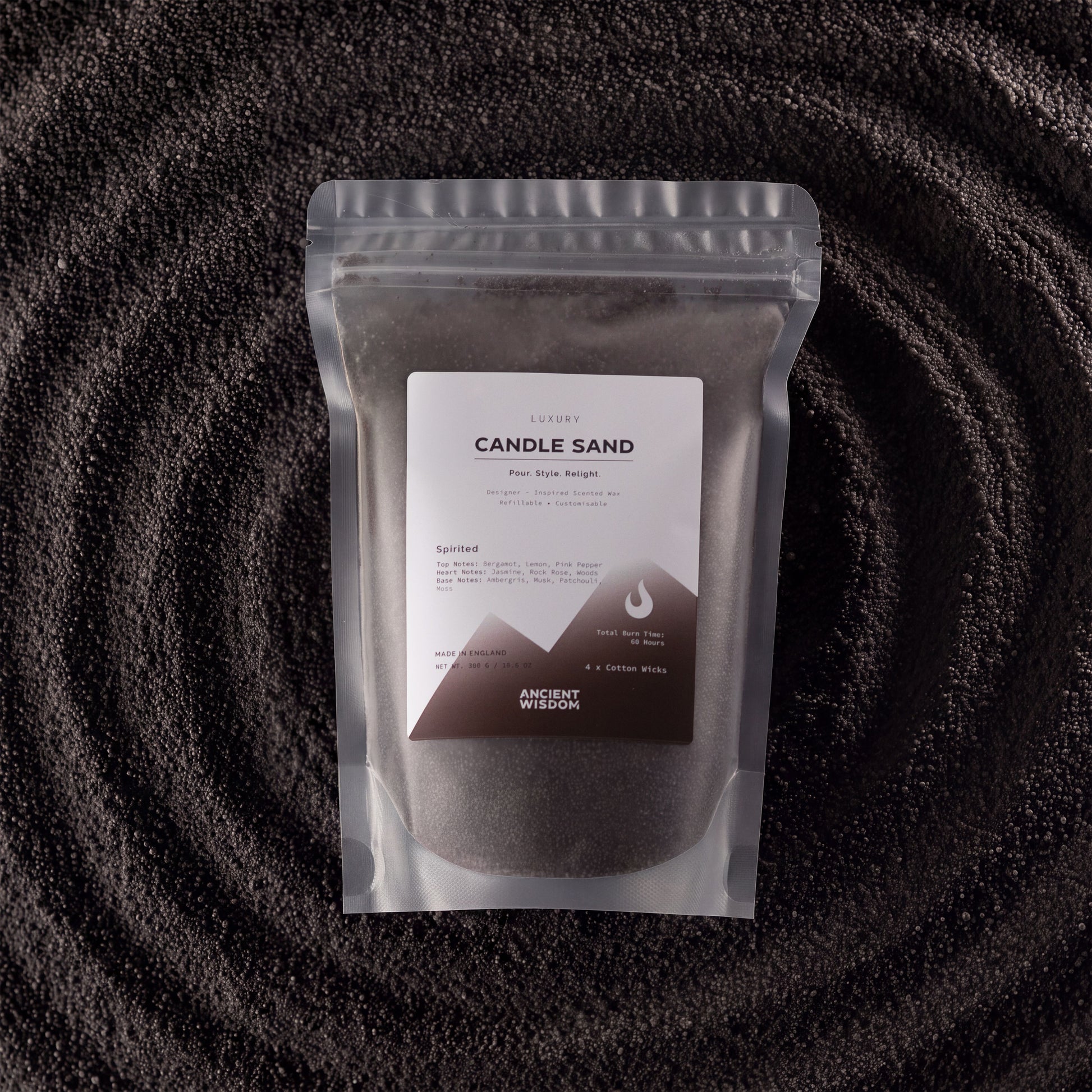 Black Spirited fragranced candle sand with four cotton wicks