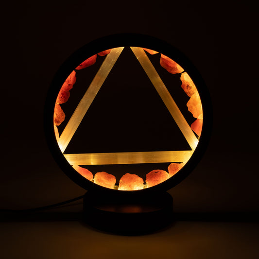 Fire Gemstone Halo Lamp with carnelian halo and selenite Fire symbol illuminated on black metal stand UK