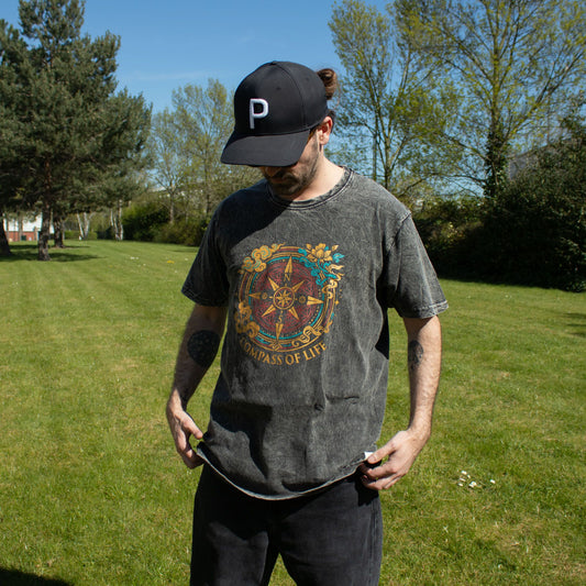 Large Nomad Sari Stonewashed Cotton T-Shirt in charcoal with Compass of Life design and soft stonewashed finish.