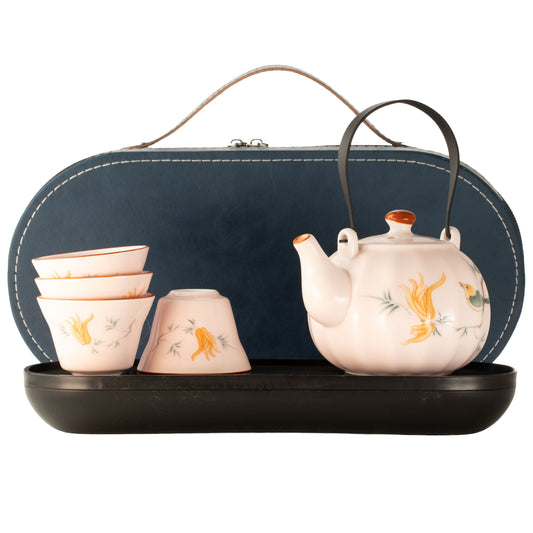 Pink vintage pumpkin-style travel teapot set with four matching tea cups