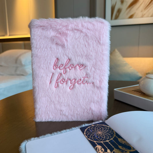 Pastel pink soft dream journal with embroidered Before I Forget wording on the cover