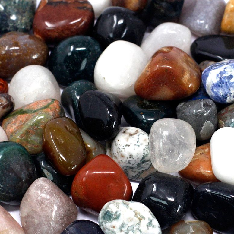 Bag of assorted polished mixed gemstone tumblestones in various colours and sizes.