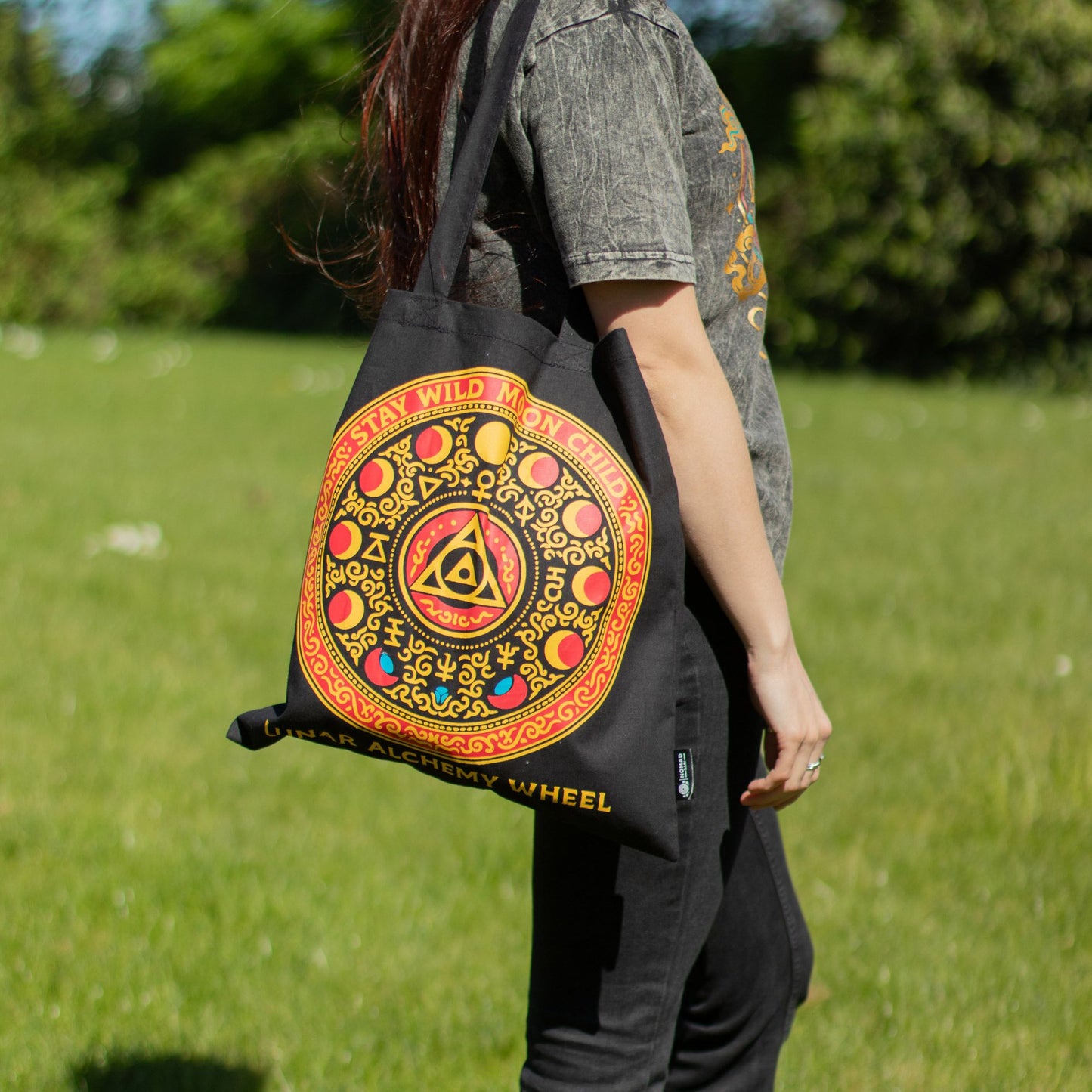 Iconic Classic Luna Alchemy Wheel black 6oz cotton tote bag featuring colourful celestial and alchemical artwork.