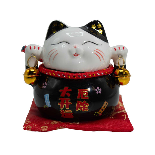 Ceramic money cat bank black on cushion Maneki Neko for protection and financial stability