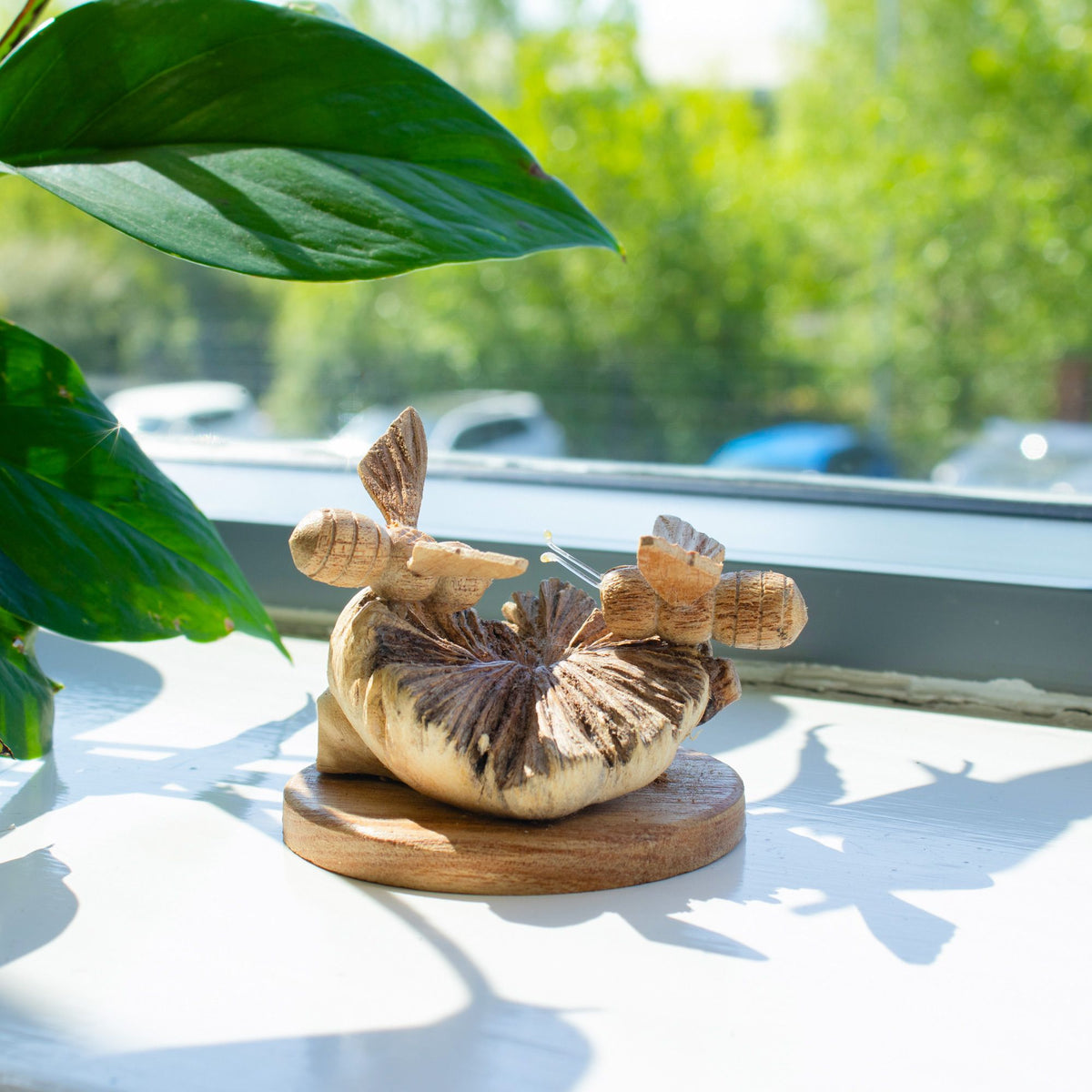 Handmade wooden bee carving with two bees on natural parasite wood base UK