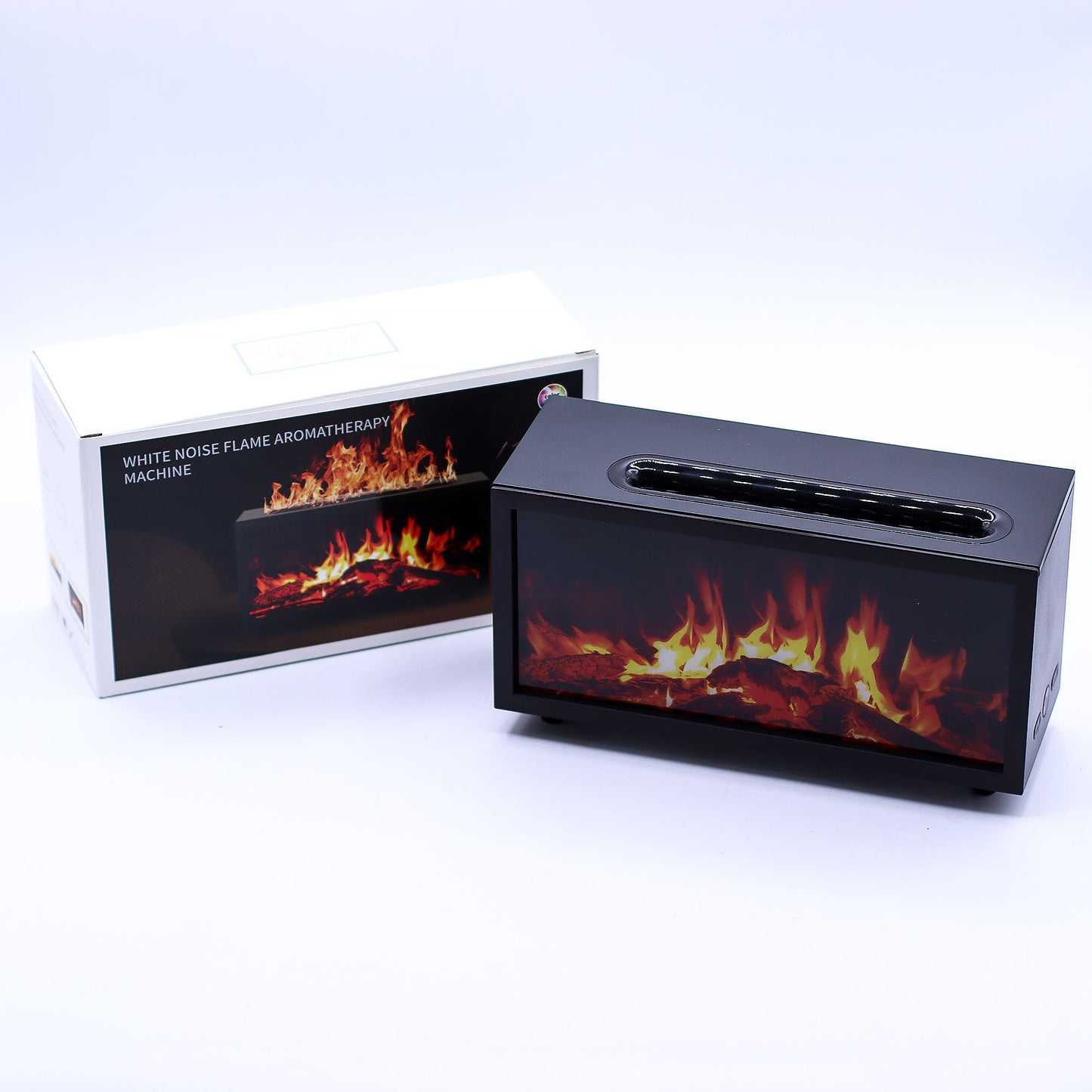 Black rectangular aromatherapy machine simulating dancing flames while sitting on a white surface with its box behind it; box text reads WHITE NOISE FLAME AROMATHERAPY MACHINE