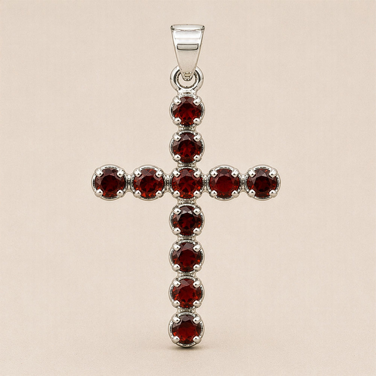Silver plated Garnet crucifix pendant with faceted deep red gemstones and matching 45cm chain for Christian devotional jewellery UK