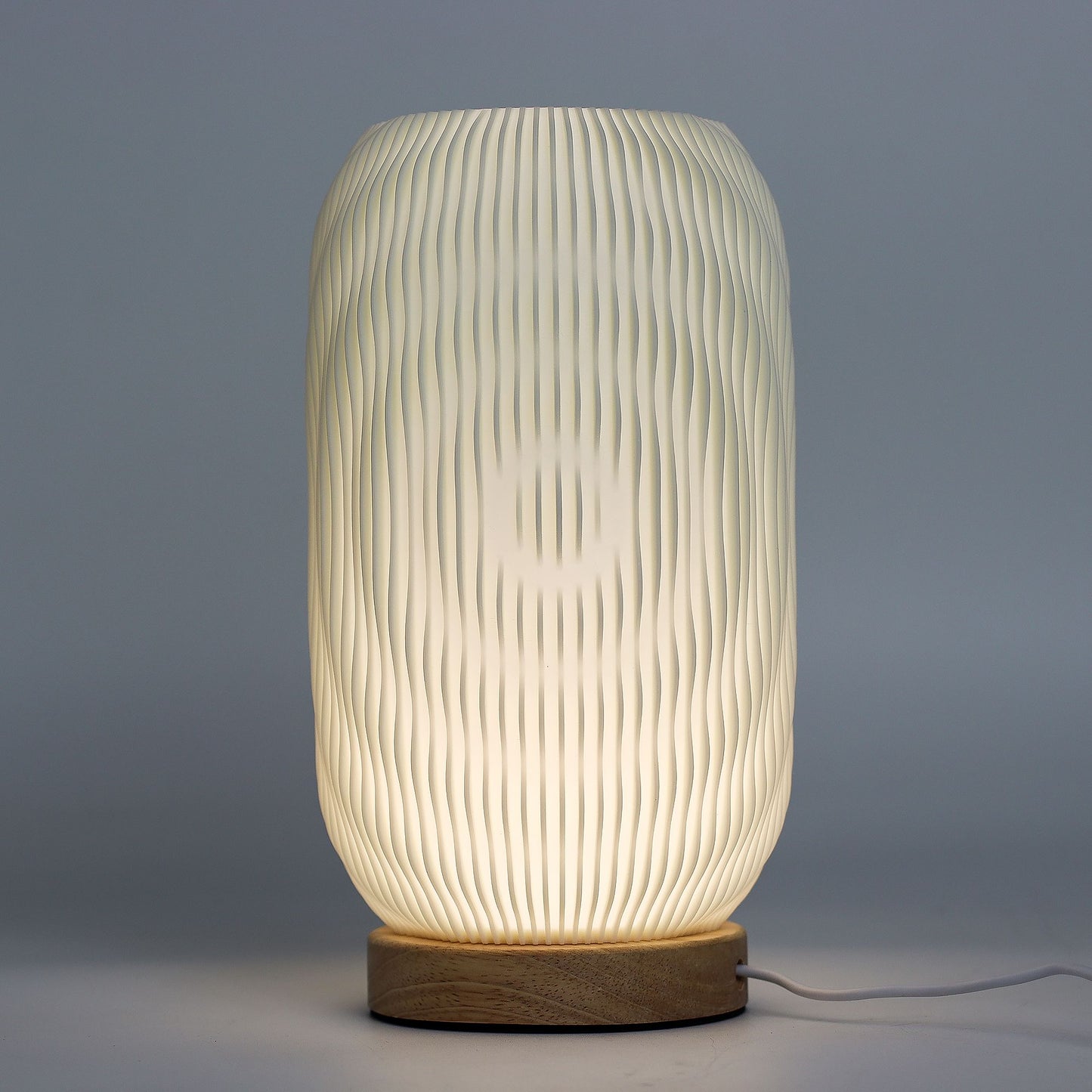 New Wave Lamp – Modern Twisted – minimalist ambient lamp with twisted silhouette and wood-effect base for contemporary home lighting UK