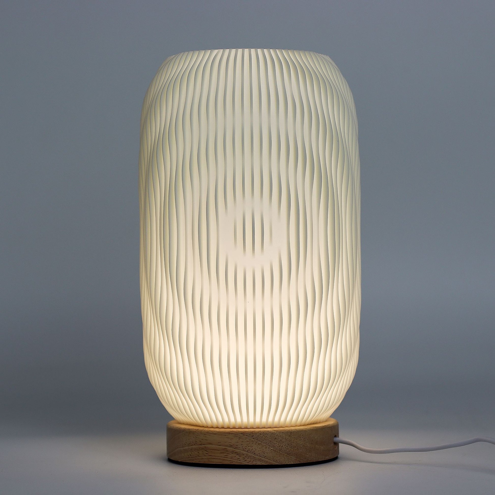 New Wave Lamp – Modern Twisted – minimalist ambient lamp with twisted silhouette and wood-effect base for contemporary home lighting UK