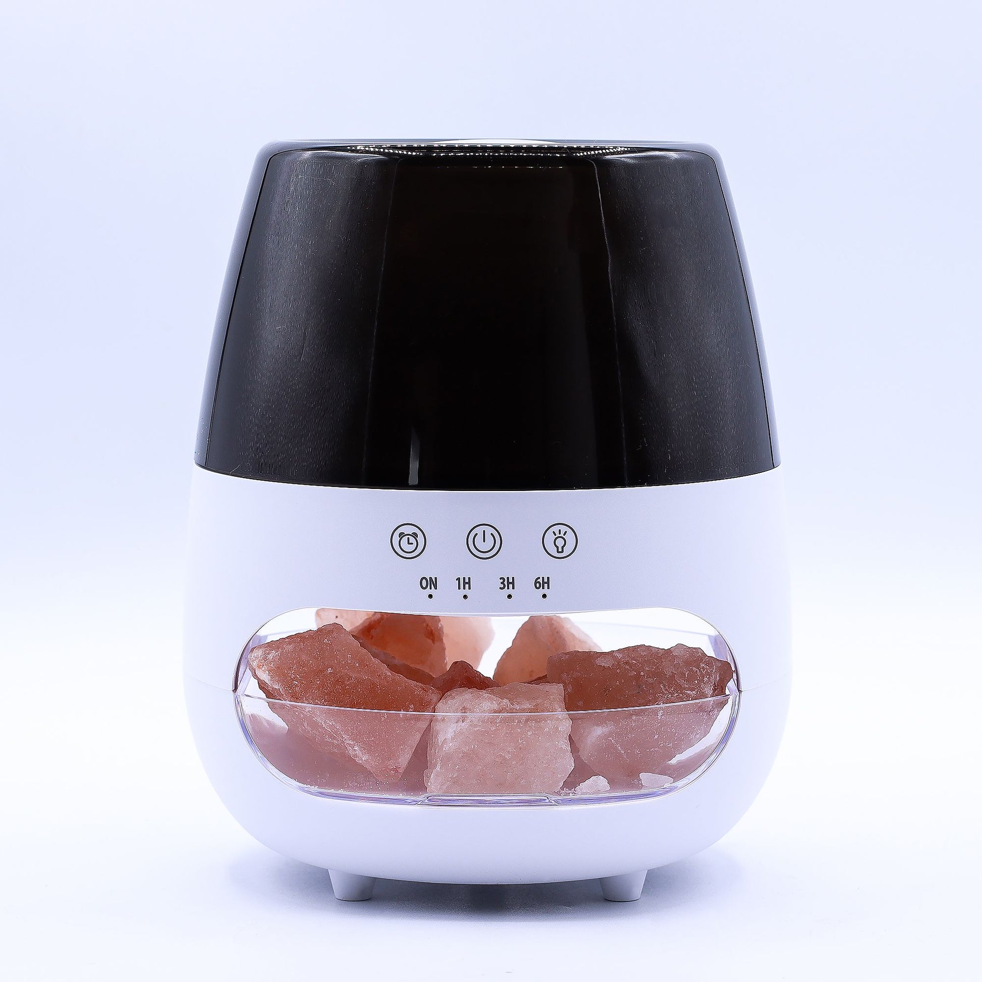 White and black diffuser-style device displays pink Himalayan salt chunks in a clear lower compartment while control icons above are labeled ON 1H 3H 6H against a plain white background.
