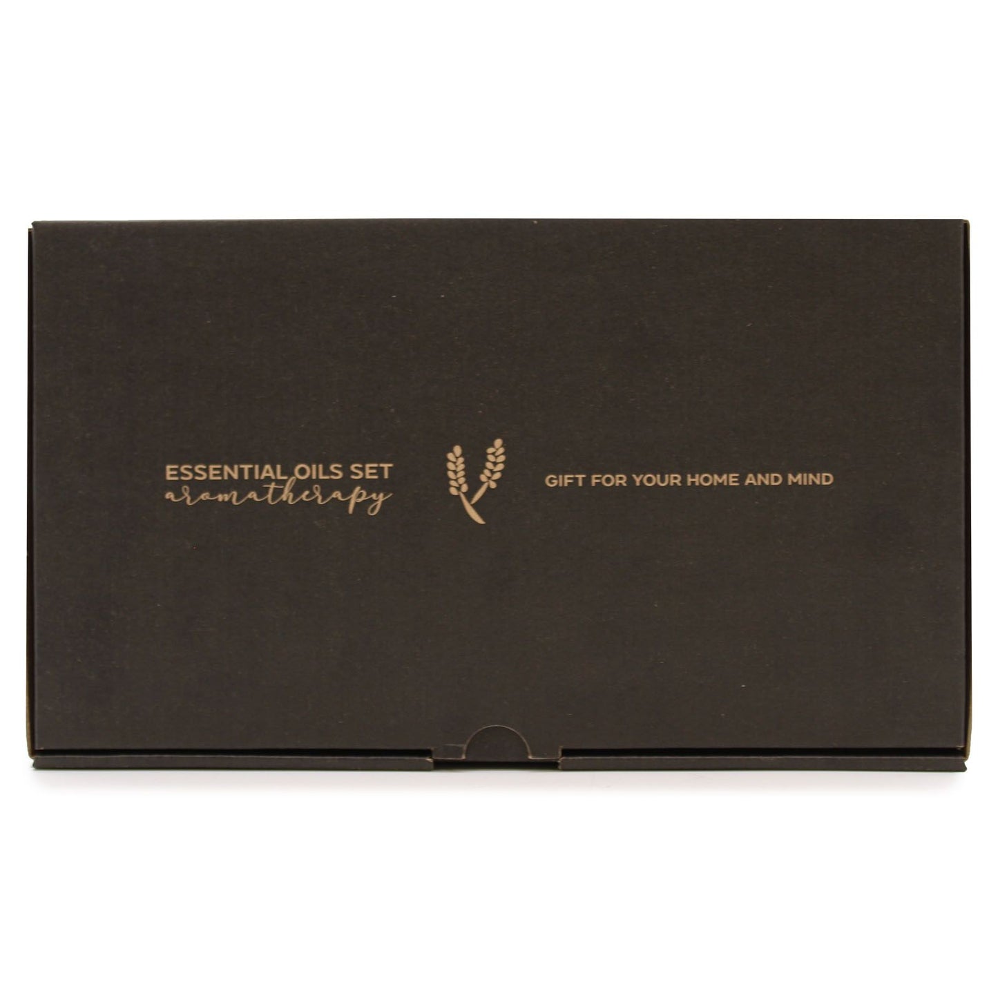 Black rectangular gift box rests on a white surface showing gold text "ESSENTIAL OILS SET aromatherapy" with a wheat sprig logo and "GIFT FOR YOUR HOME AND MIND".