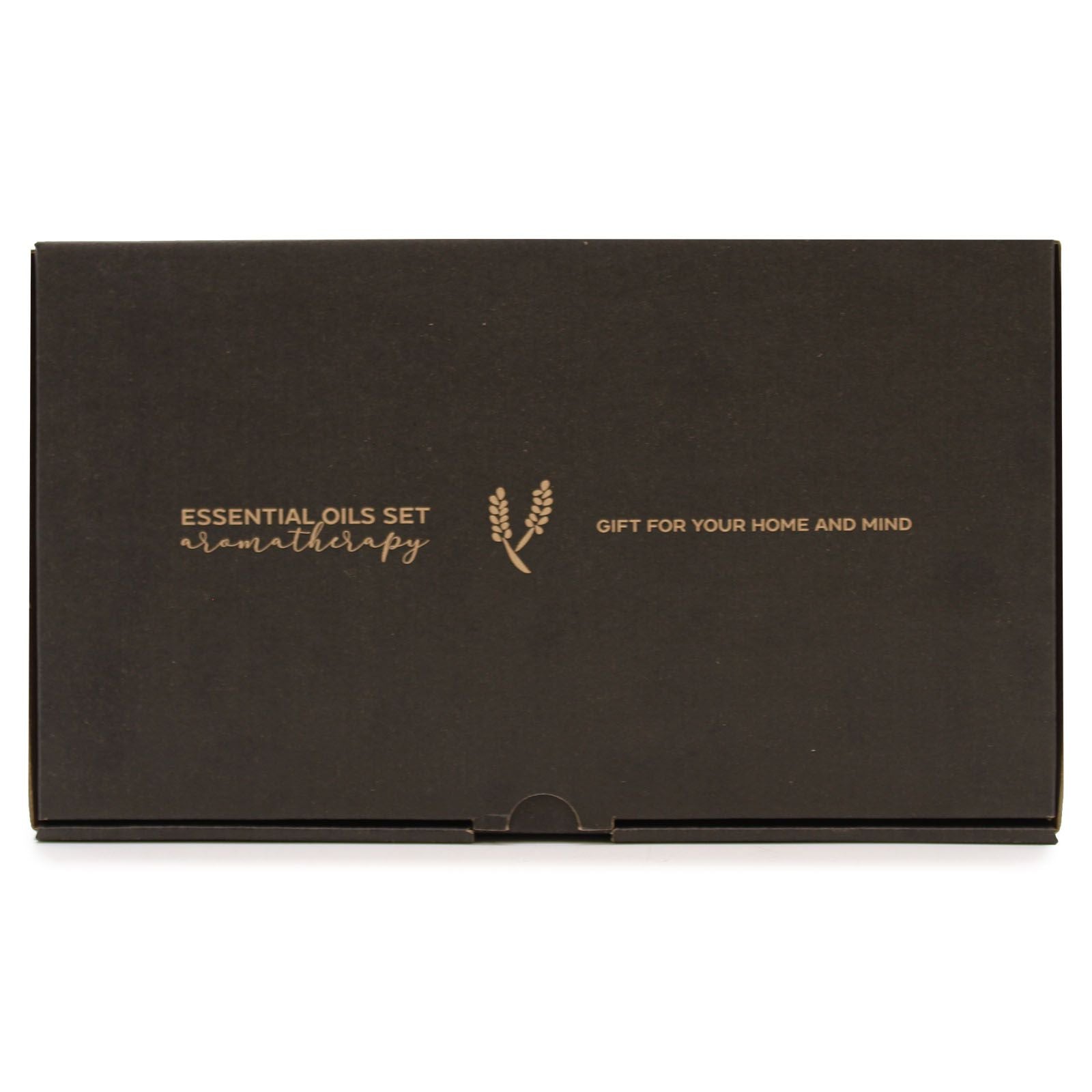 Black rectangular gift box rests on a white surface showing gold text "ESSENTIAL OILS SET aromatherapy" with a wheat sprig logo and "GIFT FOR YOUR HOME AND MIND".