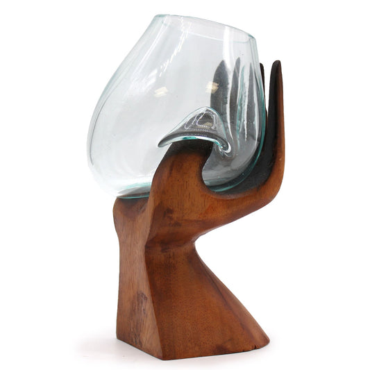 Carved wooden hand holding molten glass bowl for air plants crystals and statement home décor UK