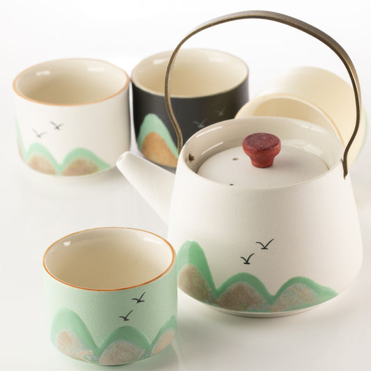 Thousand Miles ceramic tea set with teapot, four cups, ceremonial cloth and bamboo-wrapped handle