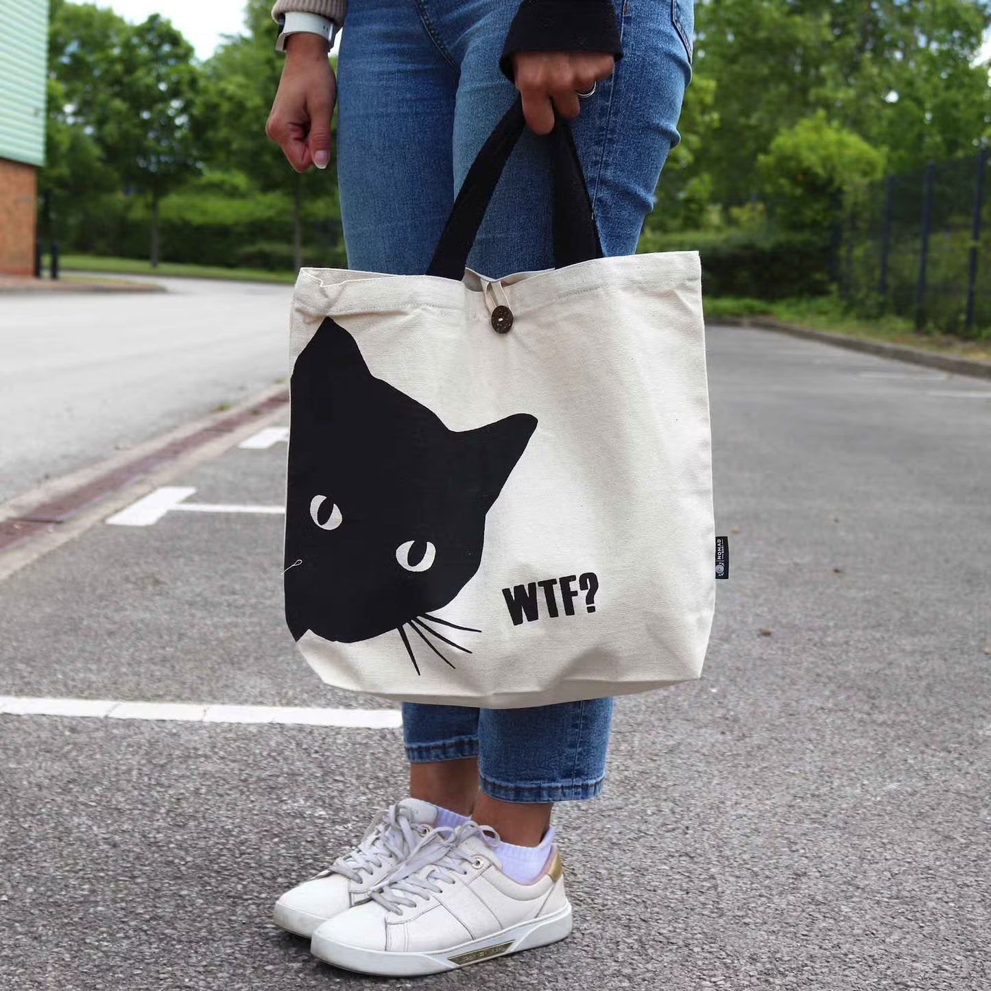 Black Cat natural 10oz cotton tote bag with playful cat design, boxed base and button closure.