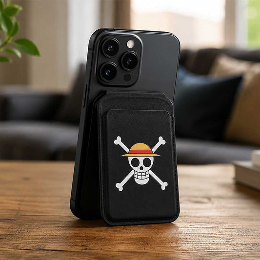 One Piece Jolly Roger MagSafe Card Holder Black - Jolly Roger holder attached to phone on a wooden table