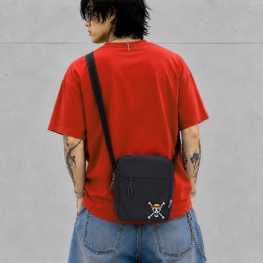 One Piece Luffy Jolly Roger Crossbody Bag Black - Black Jolly Roger bag worn with a red top
