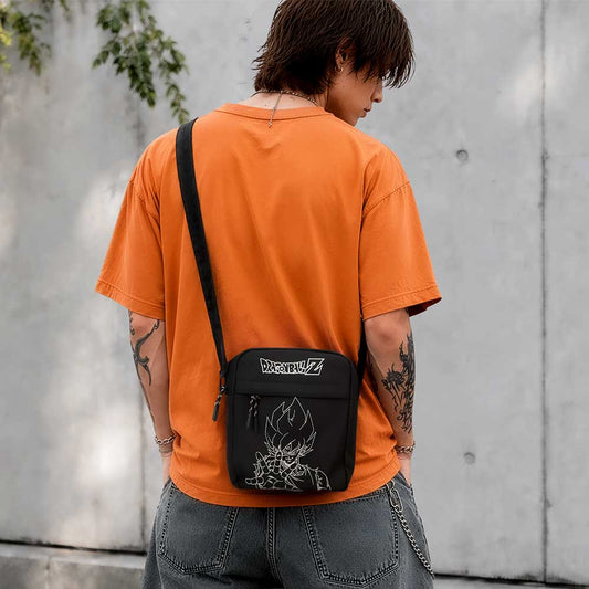 Dragon Ball Z Super Saiyan Goku Crossbody Bag Black - Black Goku bag worn with an orange top