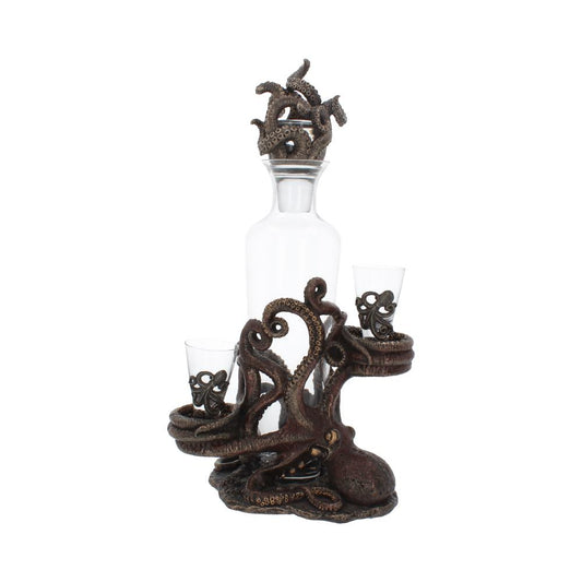 A clear glass decanter, topped with a bronze octopus-tentacle stopper, sits on a bronze octopus base holding two shot glasses with bronze octopus features, all against a plain white background.