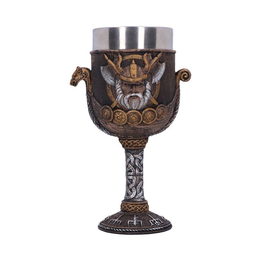 A tall, ornate goblet sits against a white background. The metal cup is mounted in a decorative, Viking-themed base with Norse symbols and imagery.