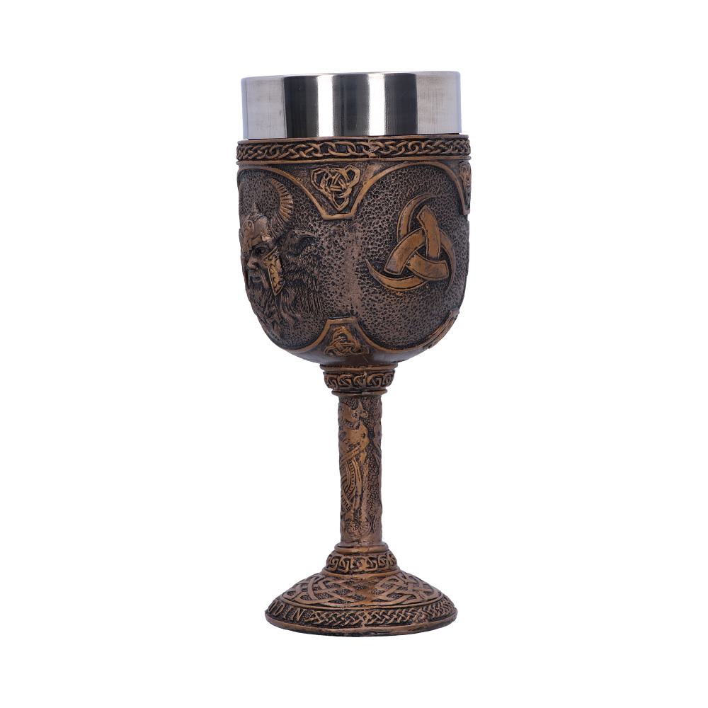 A decorative goblet, bronze with Celtic designs and a stainless-steel interior, sits upright. The background is plain white.