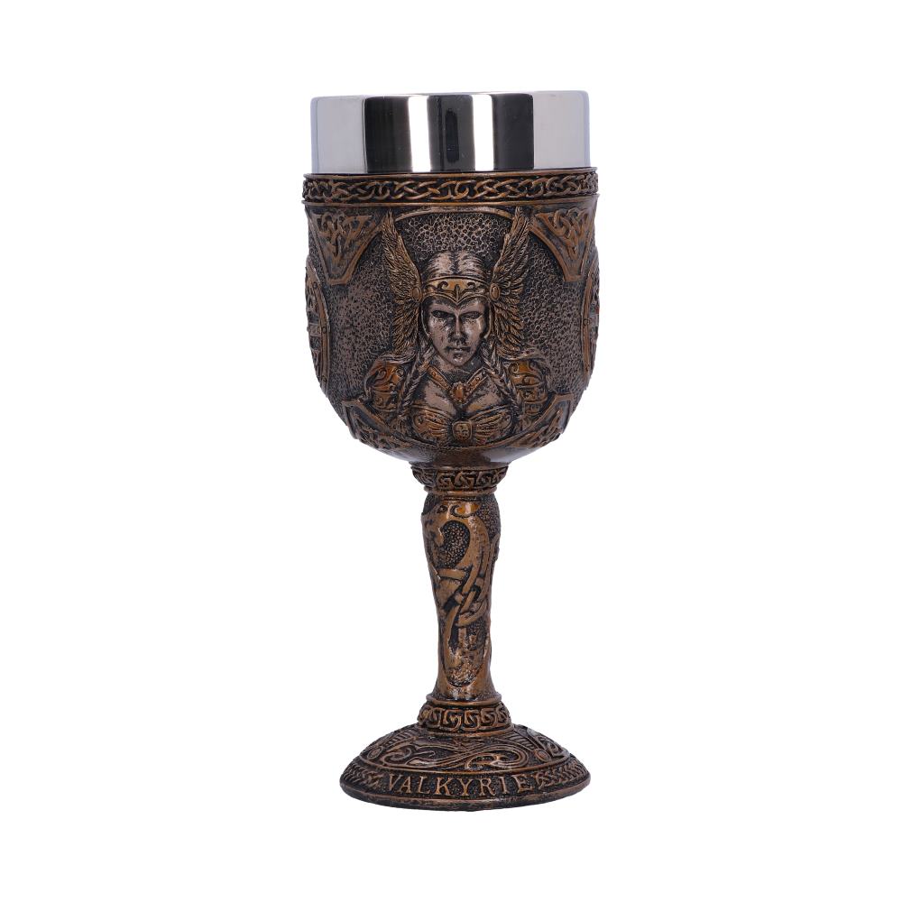 An ornate, metallic-looking goblet stands on a white surface. Carvings of a Valkyrie adorn the cup, and "VALKYRIES" is written on its base. The cup has a shiny metal interior.