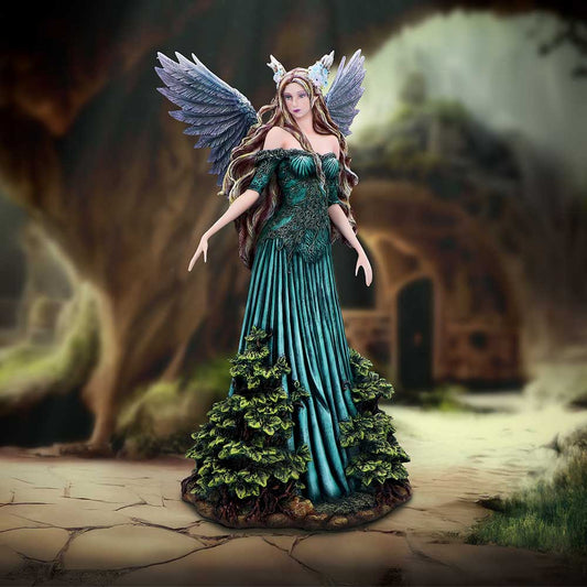 Winged female figure in an ornate teal gown stands serenely with arms slightly extended in a mossy forest clearing before a blurred stone archway.