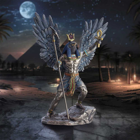 Winged Ra figurine on an Egyptian pyramid themed studio background