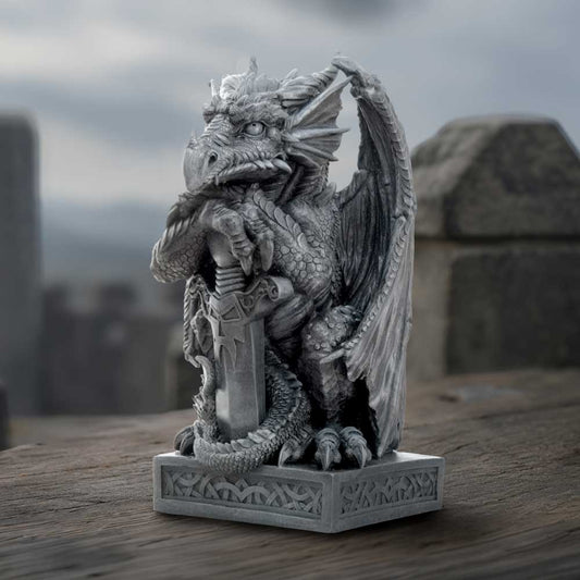 Ironblade Sentinel Dragon Ornament - sword-bearing dragon in a dark stone-themed display