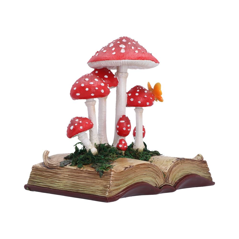 Toadstool Tales Book Ornament - side view of mushroom stems rising above the open pages