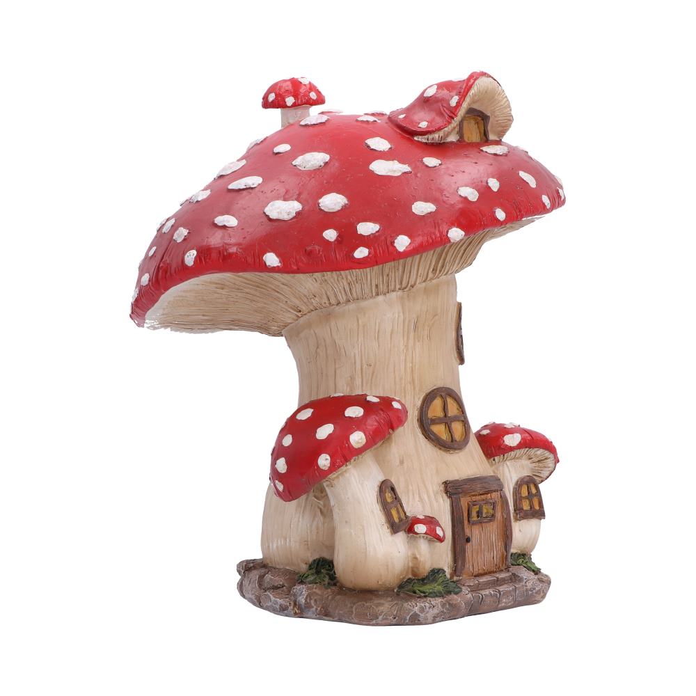 Toadstool Cottage Ornament - side view of the window frames and sculpted cottage base